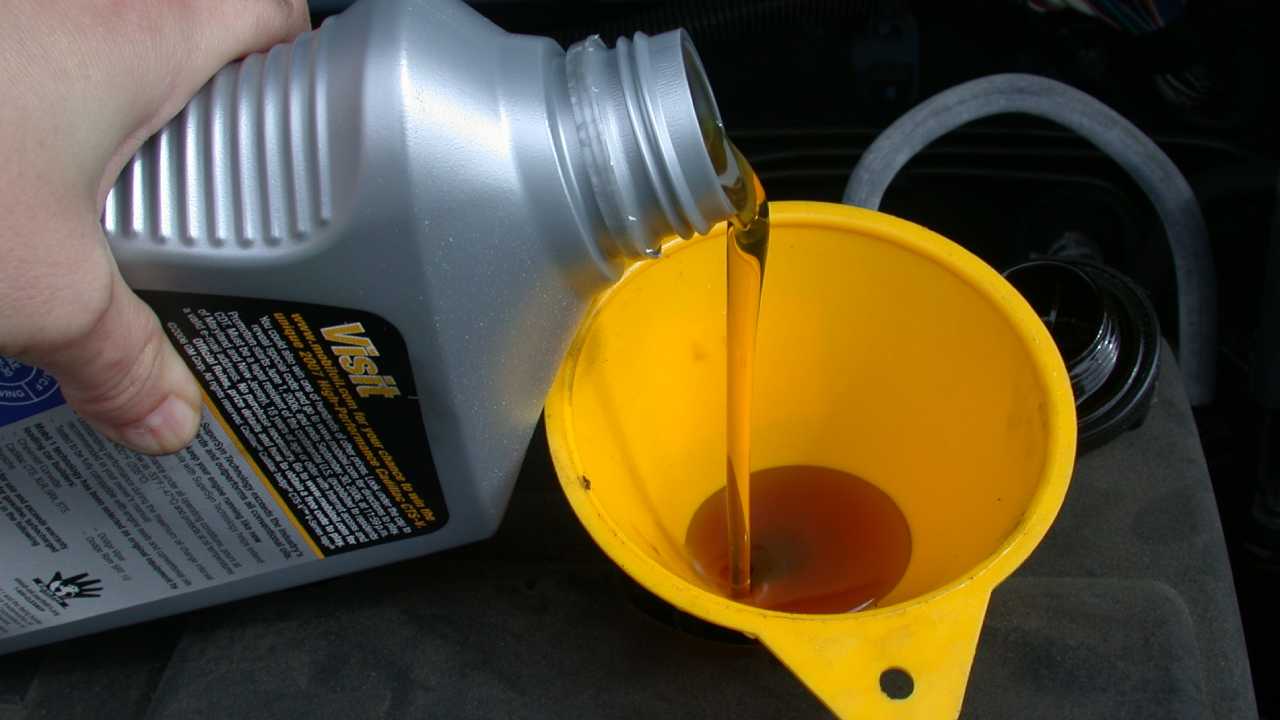car oil being poured into engine