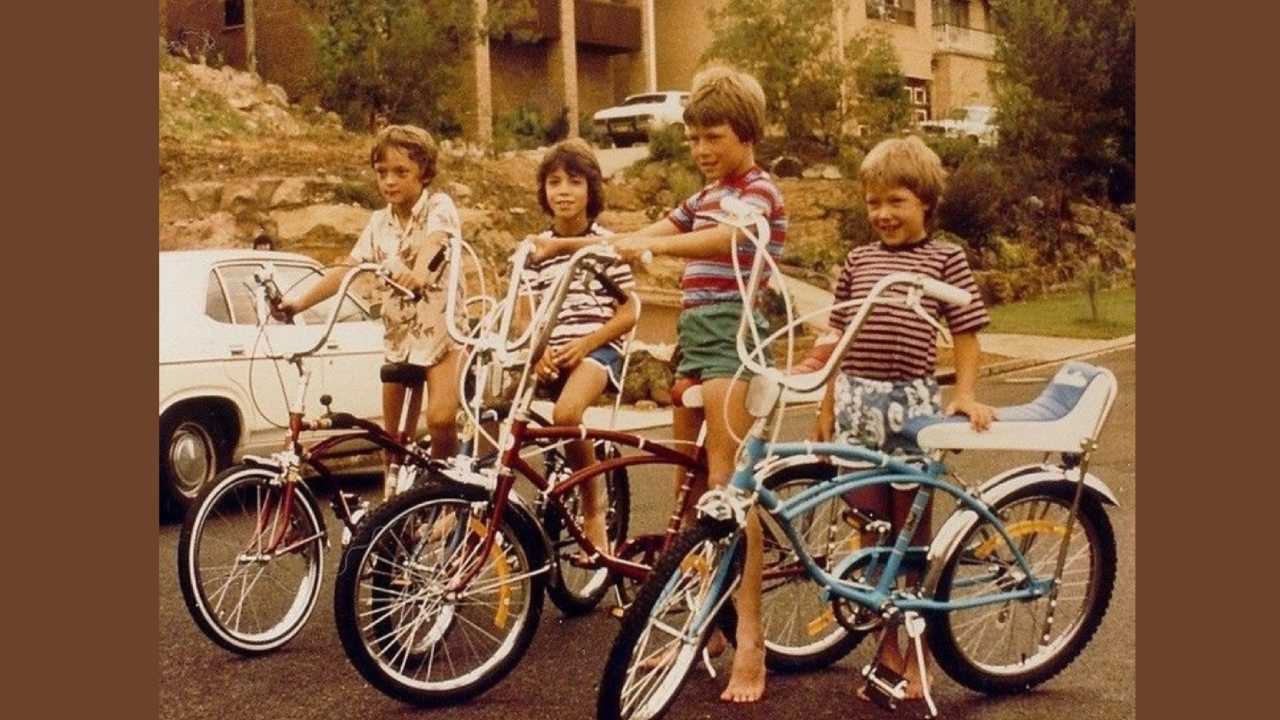 1970s kids with bicycles not wearing helmets