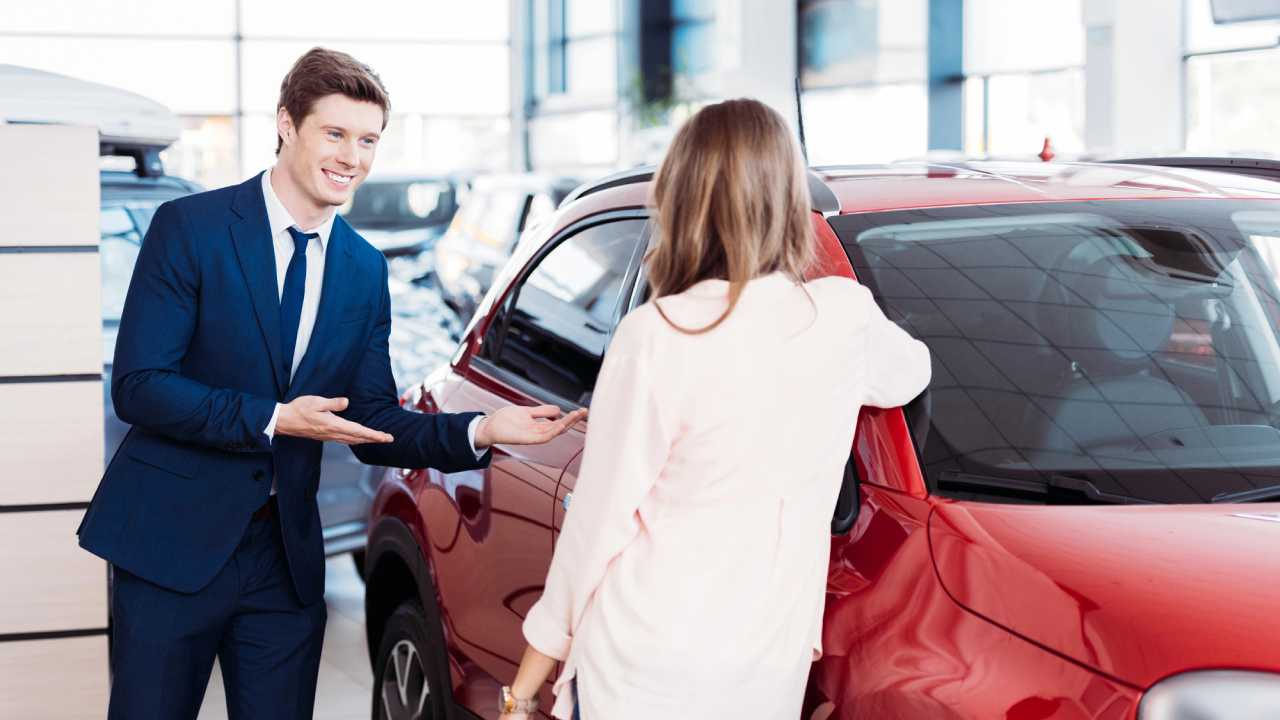 salesman trying to sell car to woman